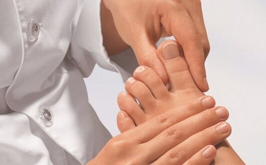 a specialist examines the feet for fungal infections